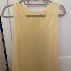Babaton yellow sleeveless blouse